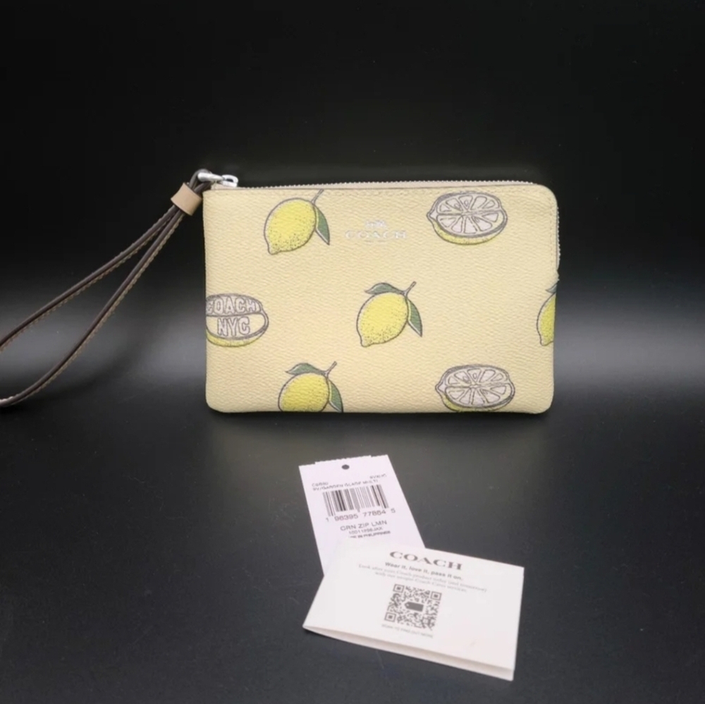 Coach Wristlet  Quarter Zip Lemons sold out everywhere ,NWT perfect Easter